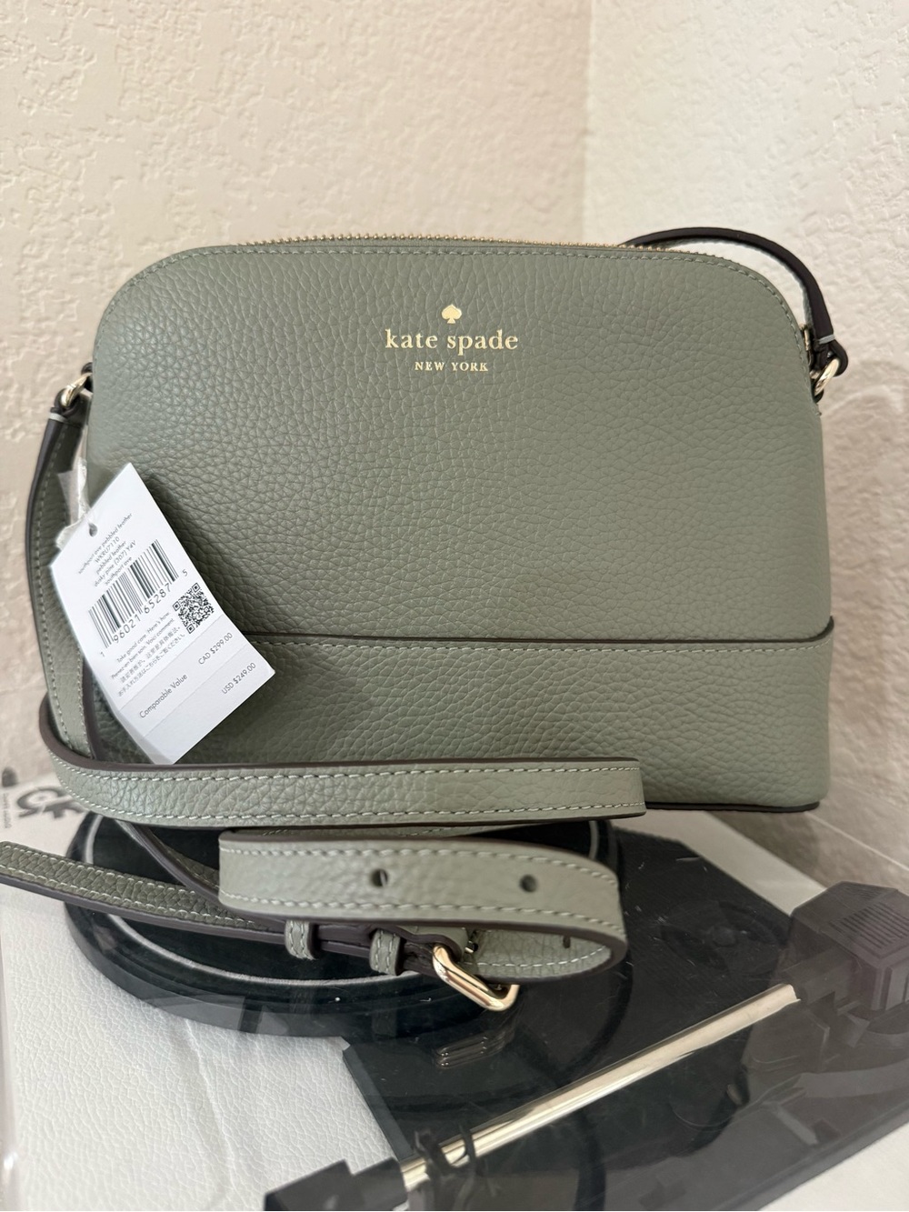 kate spade pebble leather crossbody with gold logo